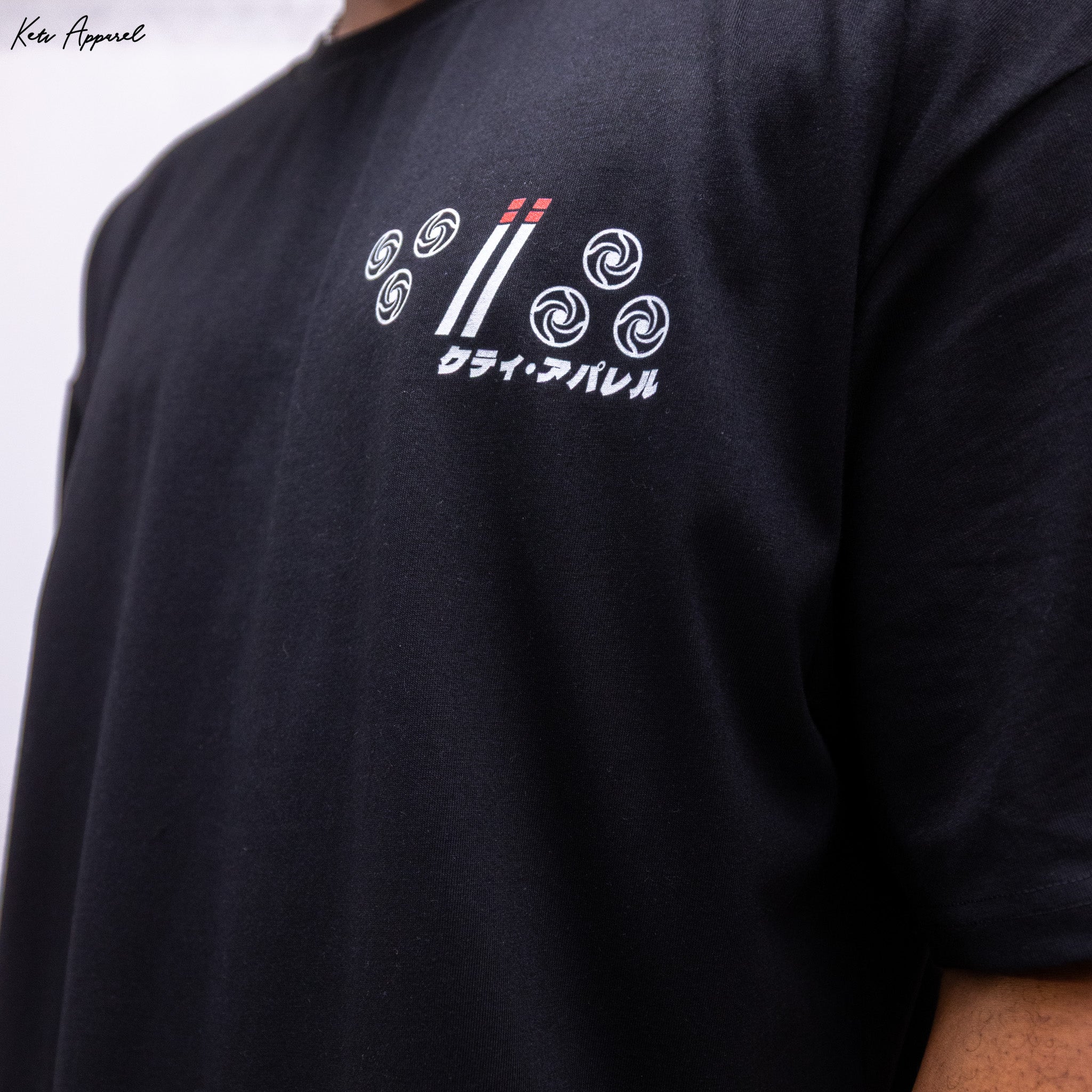 Black t-shirt with white logo and text on a plain background