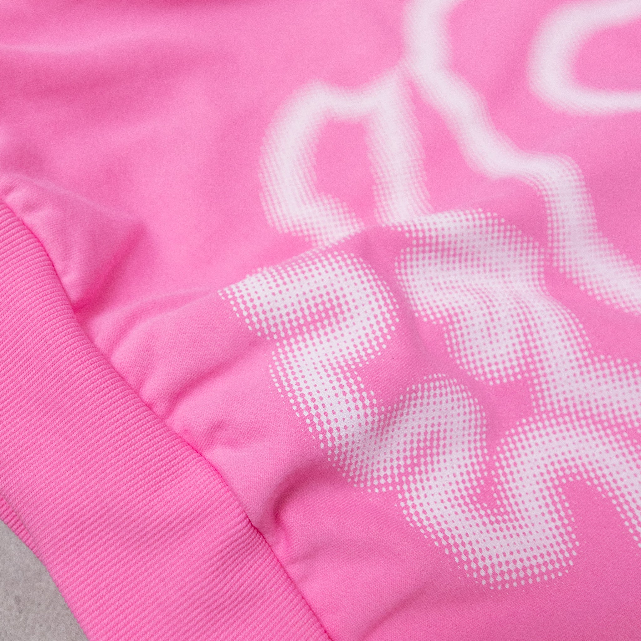 Close-up of a pink jacket with white heart patterns