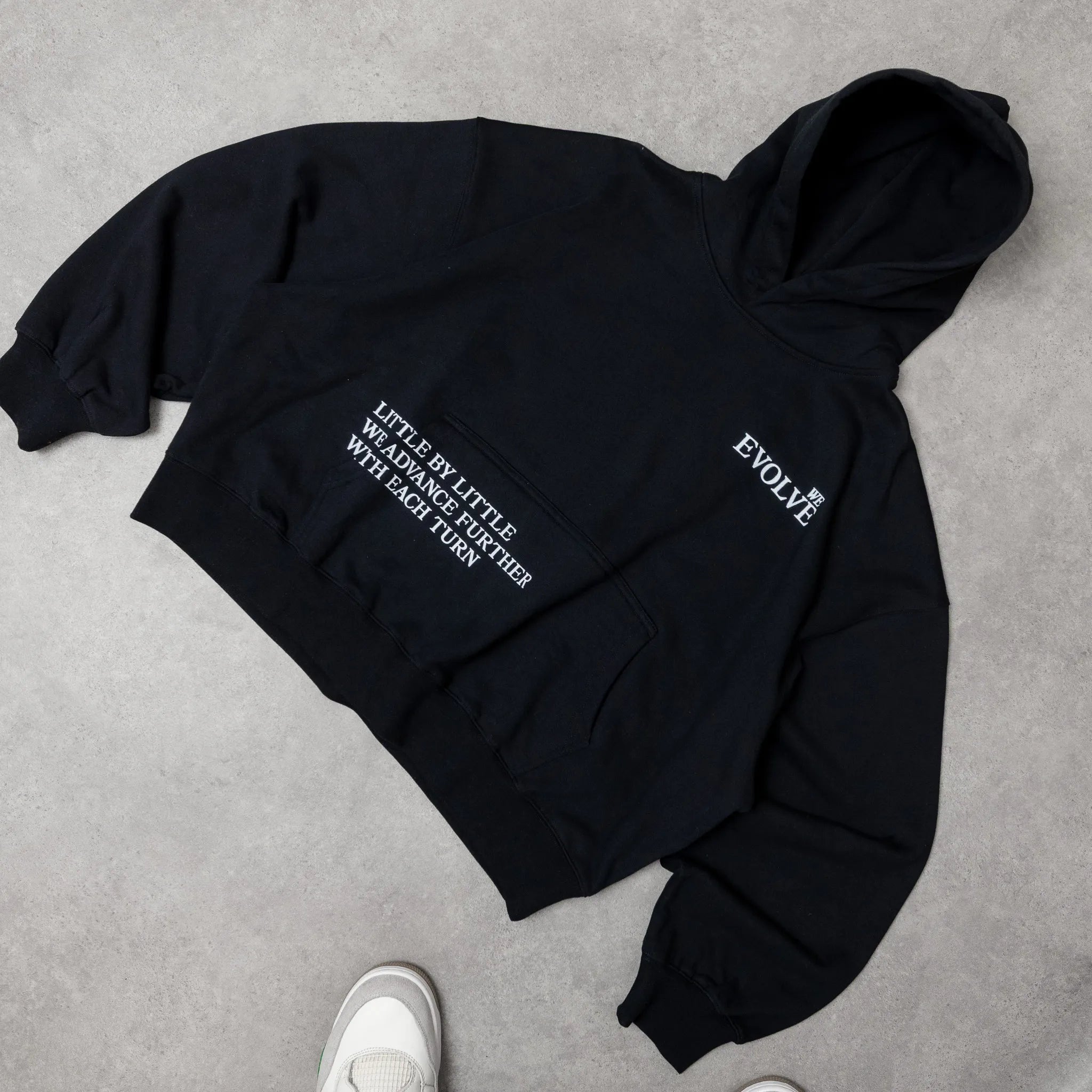 Black hoodie with text on a gray surface option1_black
