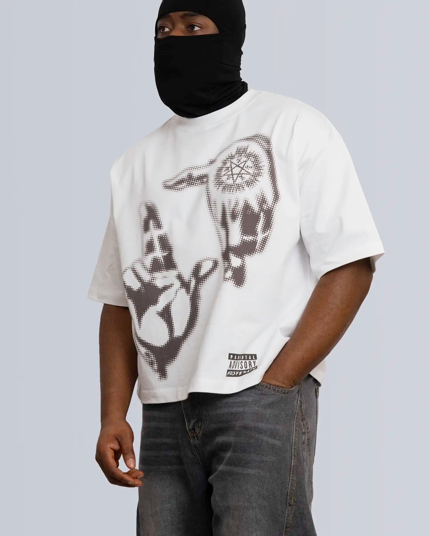 Person wearing a white t-shirt with black graphic design on a plain background option1_white