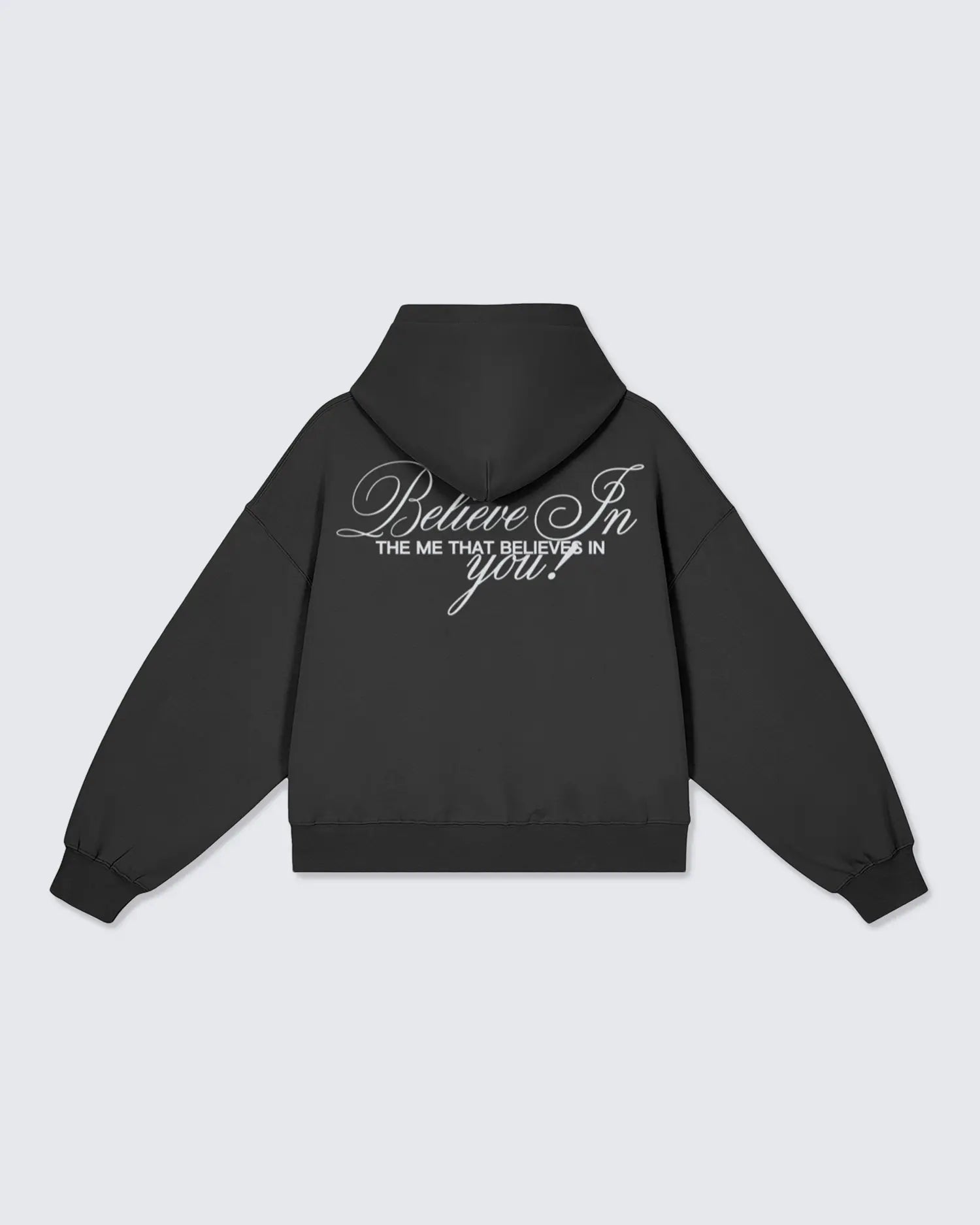 Black hoodie with "believe in the me that believes in you" text on the back against a light gray background option1_pullover option2_black
