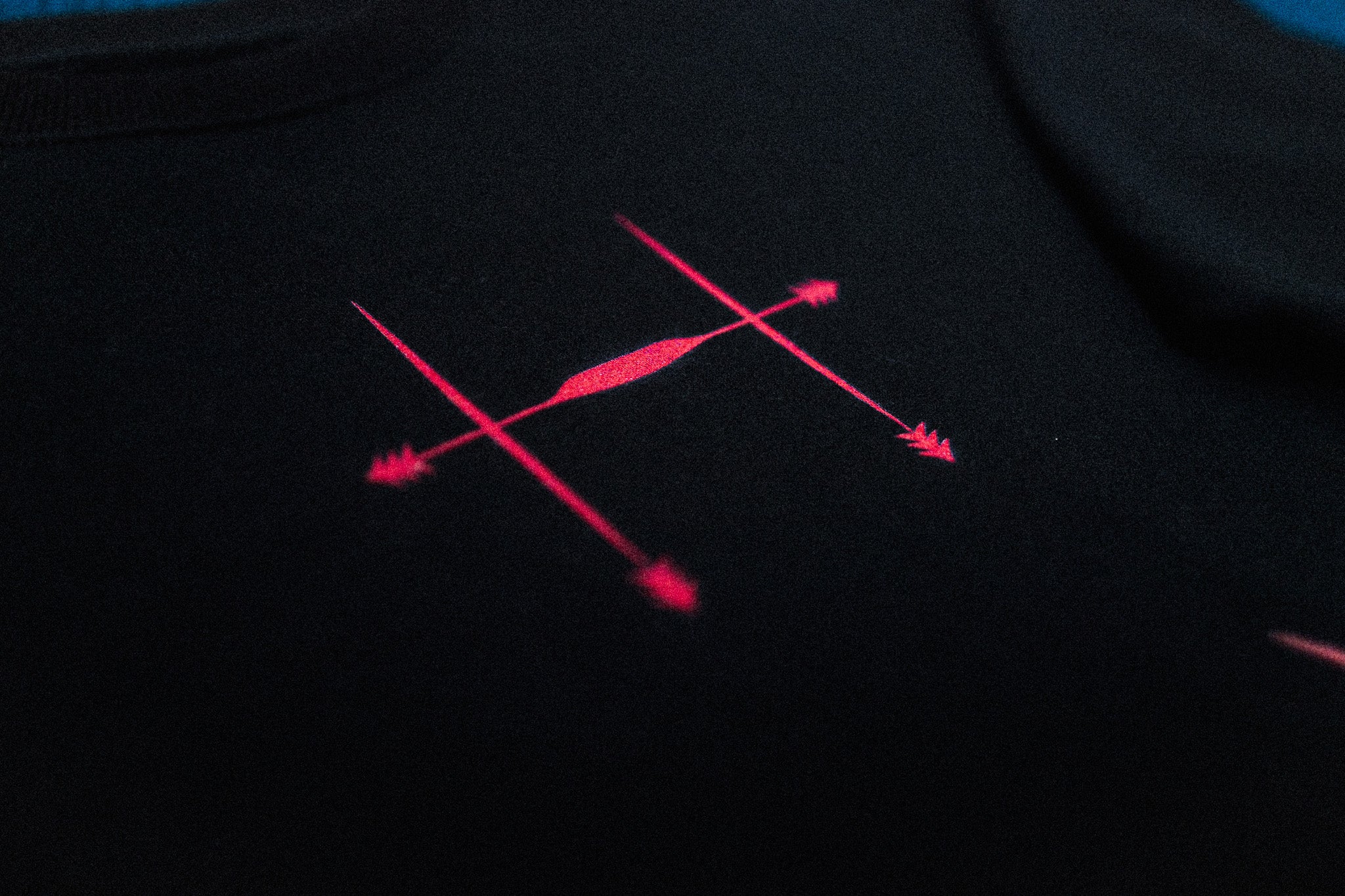 Close up of design inspired by Choso's face marks. Red design on black fabric